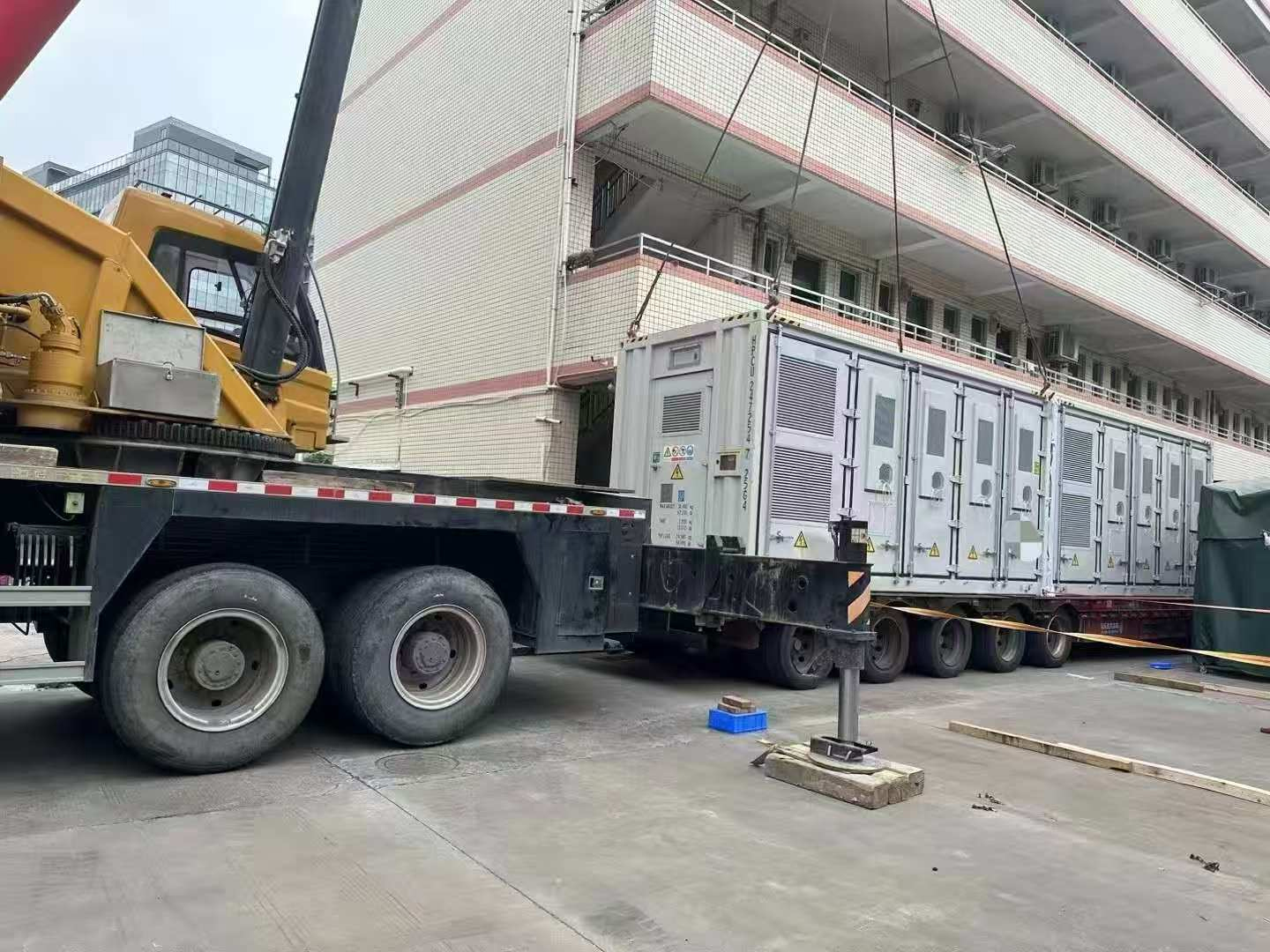 Containerized solar power system equipment during lifting and delivery preparation