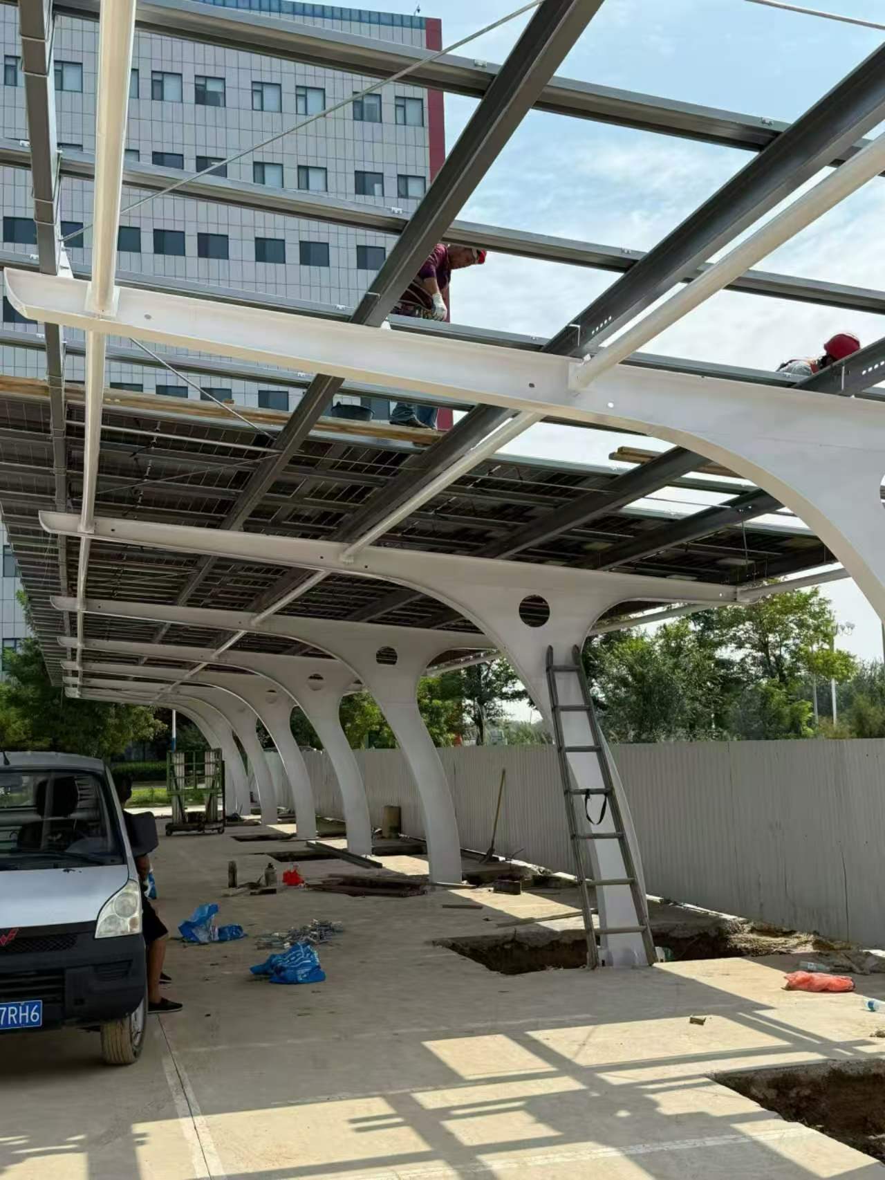 Solar panels installed on a parking lot carport structure in Tanzania